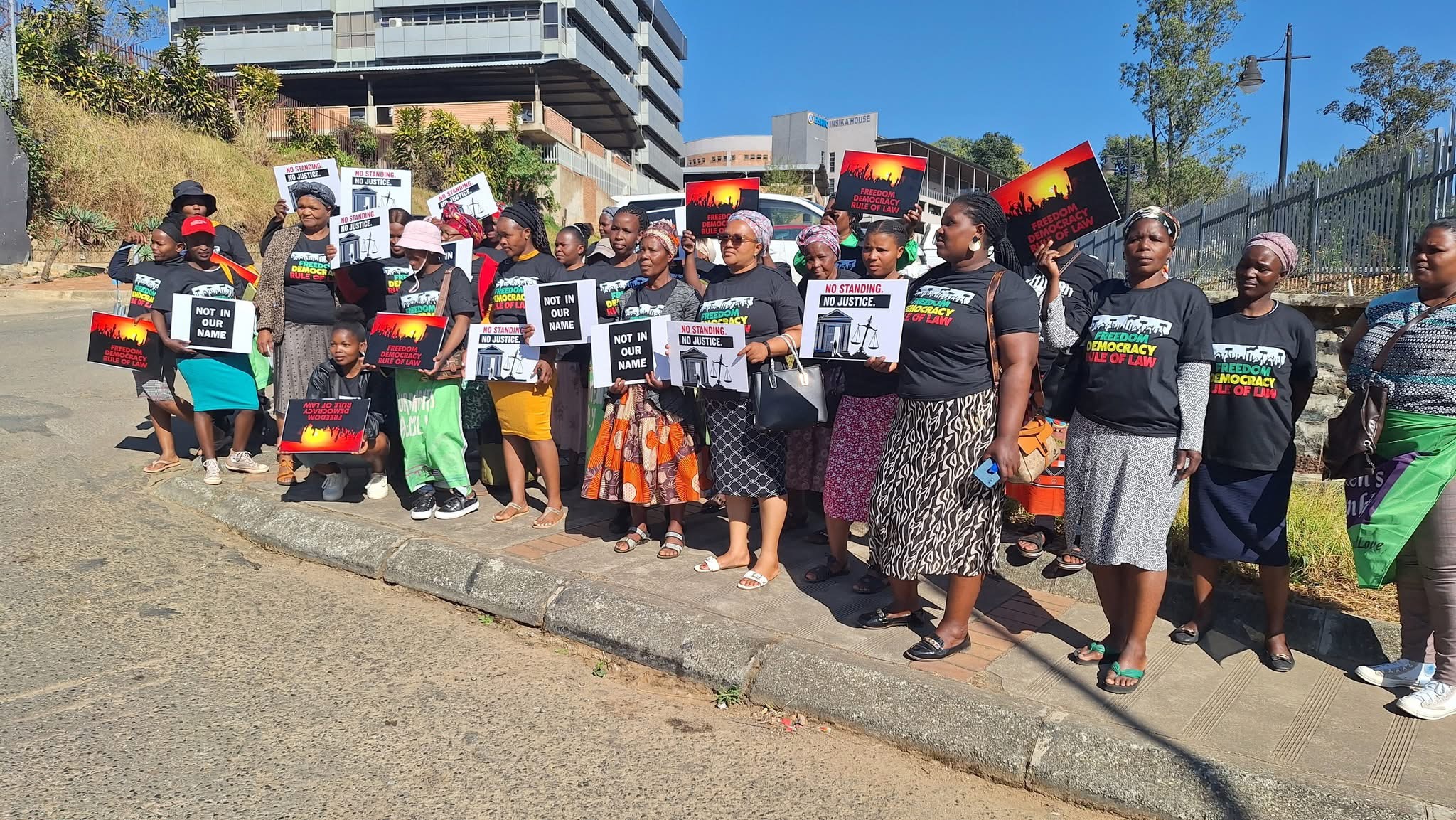 Protesting women gather outside High Court in support of Women Assembly’s court case challenging United States(US) dumping of child rape convicted criminals in eSwatini.