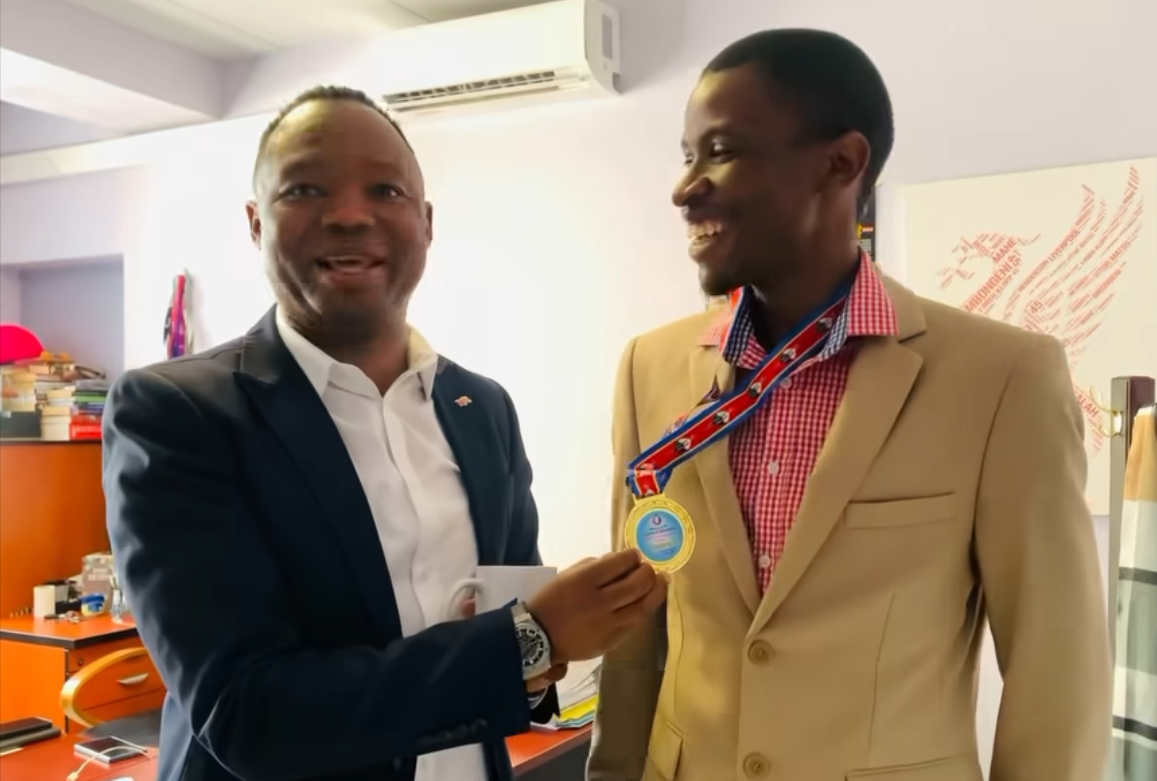 Swazi Observer Managing editor Mbongeni Mbingo congratulates media company’s Assistant Accountant Melusi Magagula who shined in the Cricket National Team win against Mozambique.